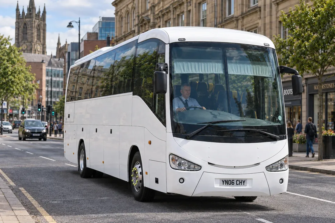 Coach travelling through a British city centre